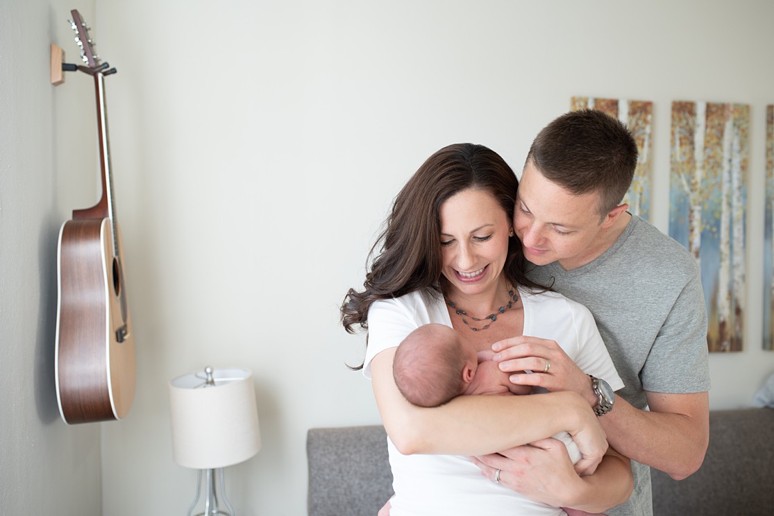 mom and dad with newborn baby boy, in home newborn photography session, san diego newborn photographer Lauren V Photography