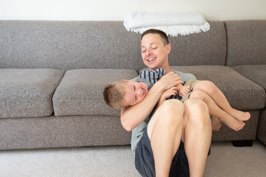 dad and son playing, san diego lifestyle newborn photographer