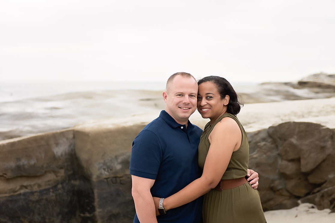 windansea beach san diego, couple in front of rocks at beach, lauren v photography