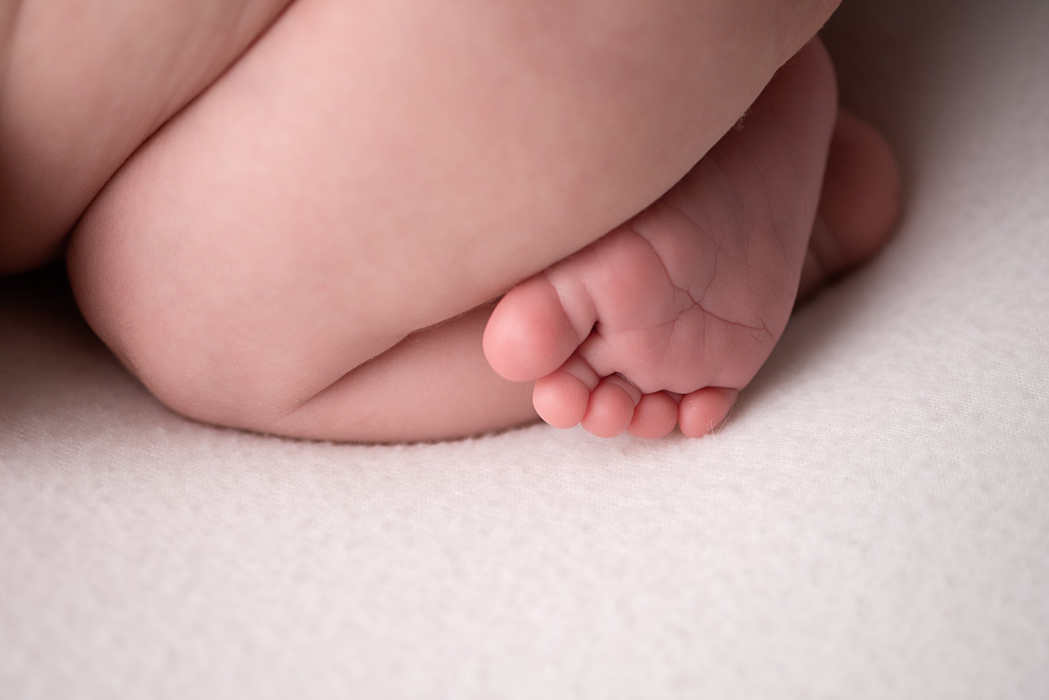 Details of a newborn baby's toes and foot